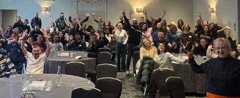 The Nexer Digital team all wave and smile at the camera