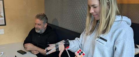 Issy tries out the Cambridge Simulation Gloves, which provide insight into how limitations in hand movement can affect product use