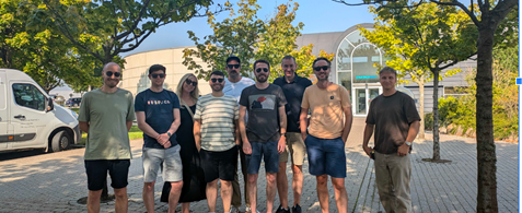 The Umbraco Sustainability Community Team stand in a group smiling