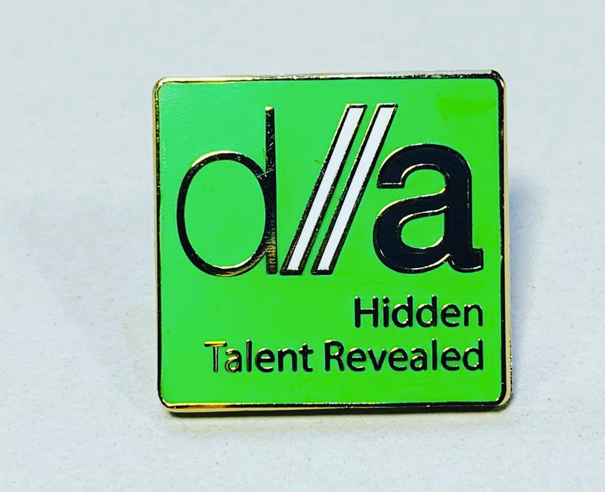 The Digital Advantage Logo on a pin badge, with the text reading "Hidden Talent Revealed"